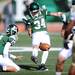 Eastern Michigan senior Austin Karcher holds the ball for sophomore Kody Fulkerson as he attempts a field goal during the second half against Western Michigan at Rynearson Stadium on Saturday afternoon. Melanie Maxwell I AnnArbor.com